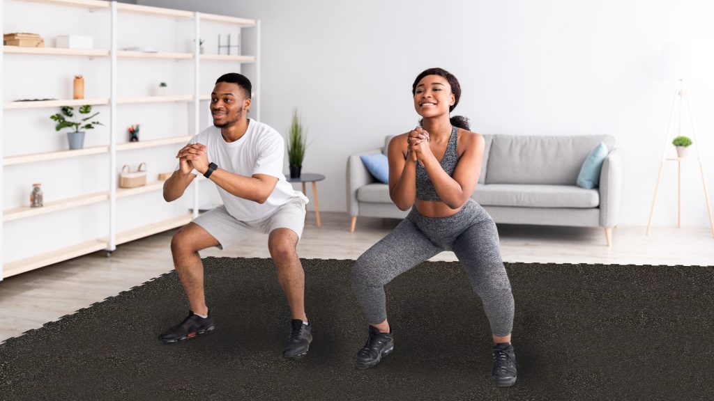 Couple working out at home on Pliteq's rubber puzzle tiles